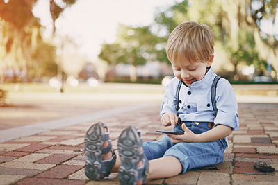 A young boy using a smartphone